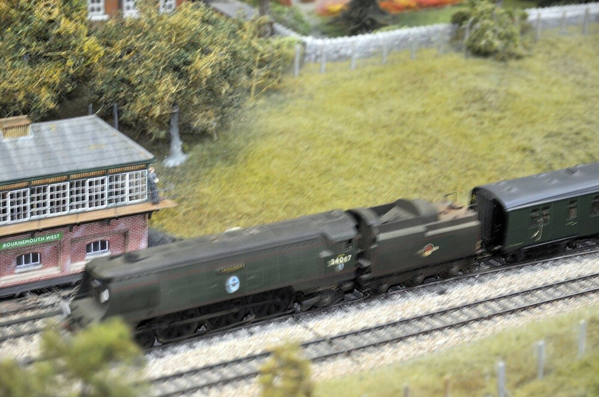 A Southern Railway Bulleid Pacific passes Bournemouth West signal box