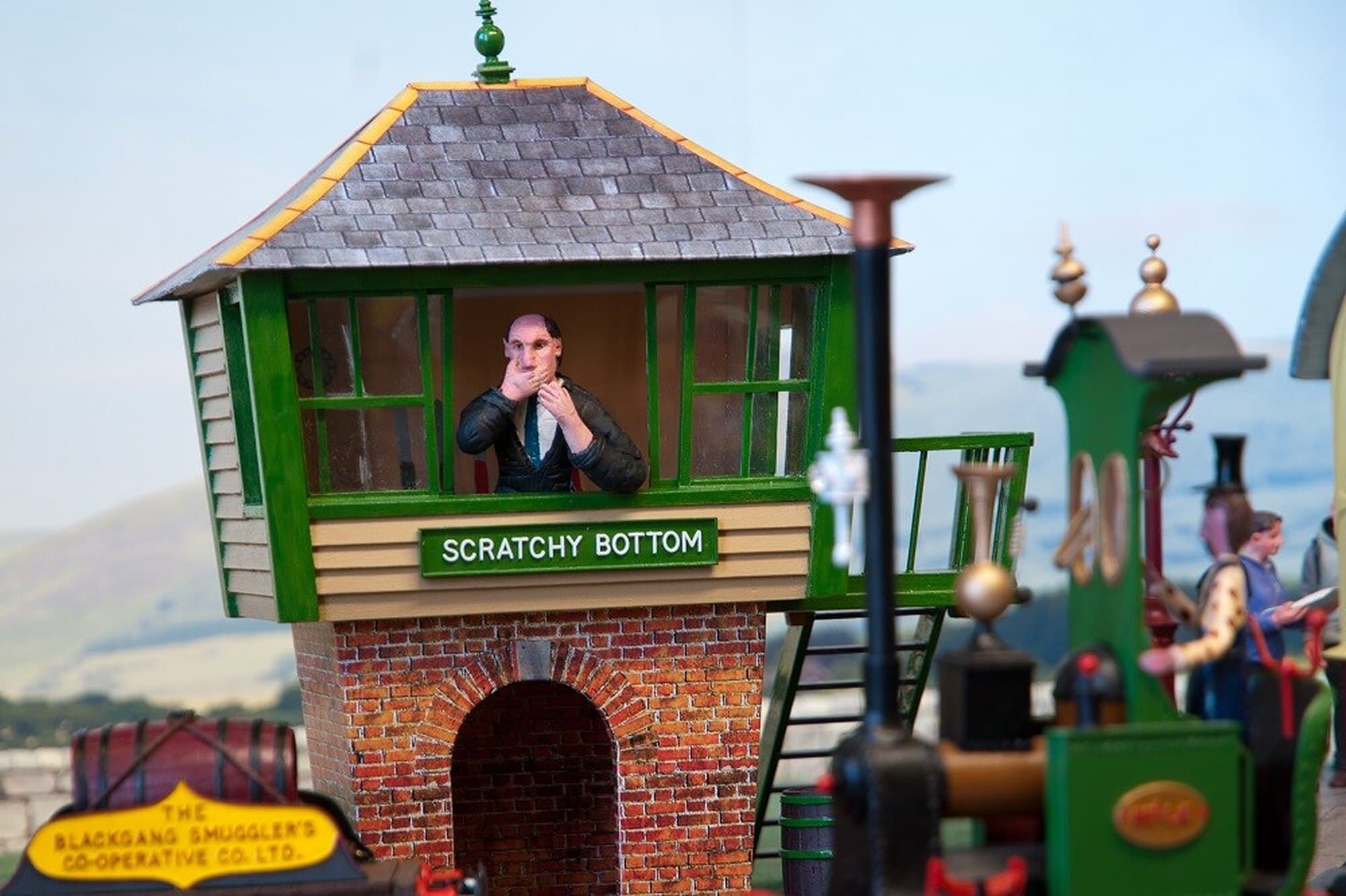 Scratchy Bottom signal box with a tiny signalman at the window