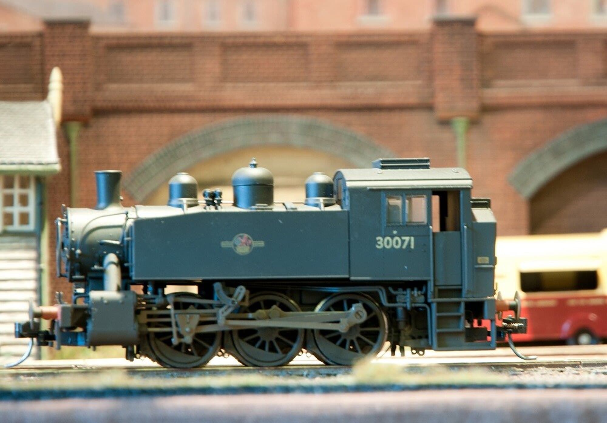 BR USA tank locomotive 30071 in close-up against a brick arch